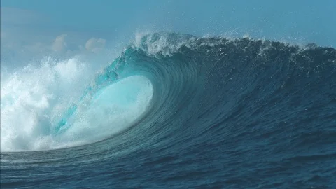 SLOW MOTION: Breathtaking turquoise barrel wave crashes on a perfect summer day. Stock Footage