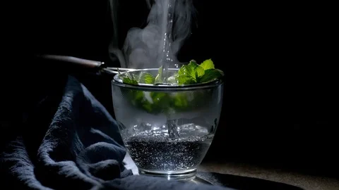  slow motion brewing tea with mint in a mug Stock Footage 125256199