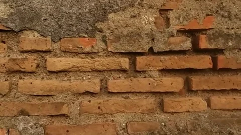 Slow motion of a brick wall surface Stock Footage 154336809