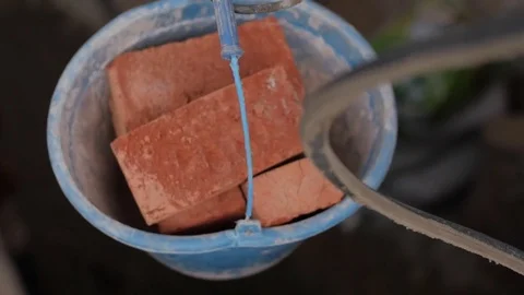 Slow motion of bricks load in a plastic bucket Video stock 75887628