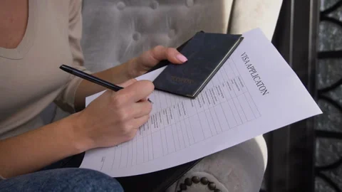 Slow motion bride execute documents to get visa for honeymoon Stock Footage 88609870