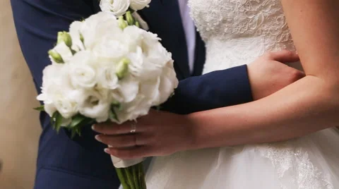 Slow motion of a bride holding eustoma bouquet Stock Footage 63862572