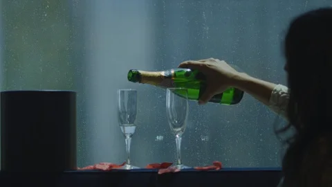 Slow motion of bride pouring champagne in two glasses Stock Footage 115925405