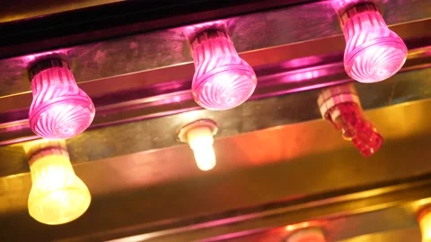Slow motion of bright colorful lights flashing in a carnival Stock Footage 148196493