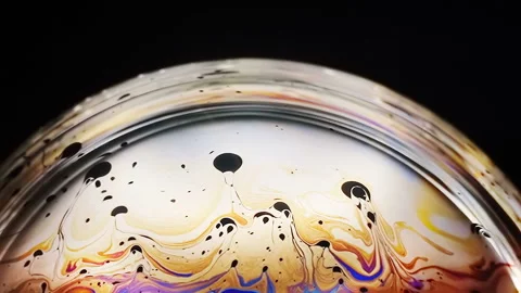 Slow motion of bright neon colored patterns on the surface of the soap bubble Stock Footage 103431794