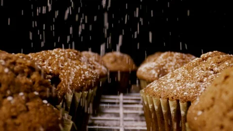 Slow motion brown muffins sprinkle with sugar close up Stock Footage 112633176