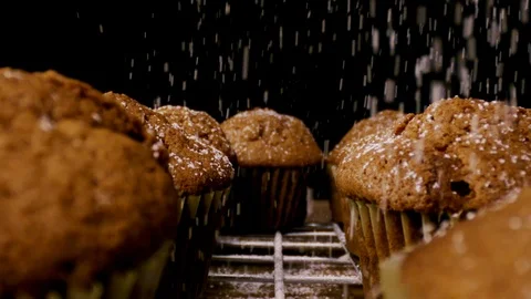 Slow motion brown muffins sprinkle with sugar close up Stock Footage 112633768