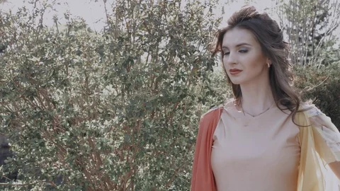 Slow motion. Brunette in the forest. Stock Footage 76296176