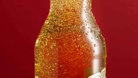 Slow motion bubbles rise up in a beer bottle Stock Footage 148160916