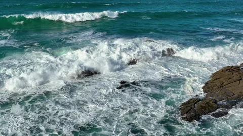Slow Motion Of Bubbling Blue Ocean Water With White Foam Surfaces. Stock Footage 255720321