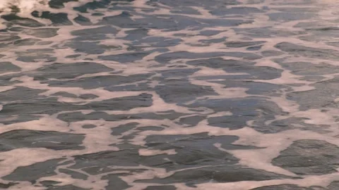 Slow motion of bubbling foaming ocean waves off the coast of the island of Bali  動画素材 186973567