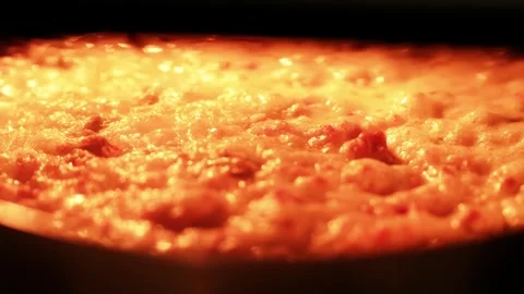 Slow Motion Bubbling Melted Cheese Baking in Oven Close Up Видео 330943562