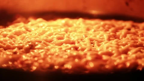 Slow Motion Bubbling Melted Cheese Baking in Oven Close Up 2026 Видео 330943573