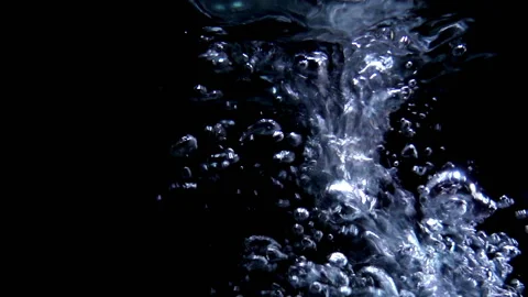 Slow motion bubbling in water on a black Stock Footage 102924975