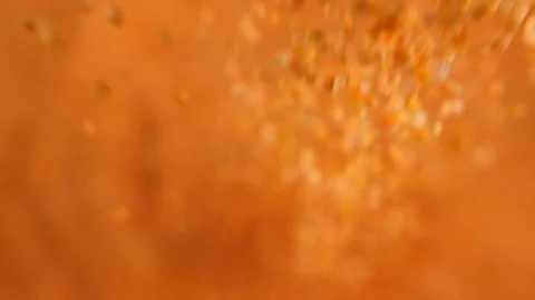 Slow motion bulk dry red lentils dropping a portion of legumes, poured Stock Footage 88336560