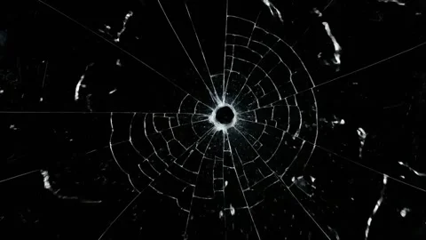 Slow Motion Bullet Hole Cracking Glass on Black Background. Video stock 317800850