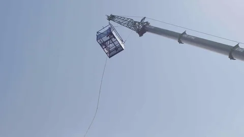 Slow motion Bungee Jumping off Crane, Blue Sky Stock Footage 76749901