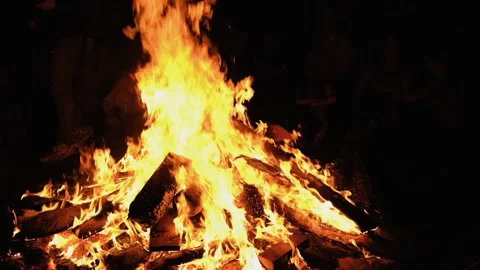 Slow motion burning bonfire. Close-up shot of warm cozy burning fire. Slow Stock Footage 157846422