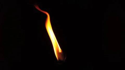 A slow-motion burning fire that is the top of a torch. 
Flying looks like Stock Footage 120040970