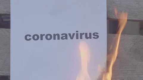Slow motion burning paper with the black word CORONAVIRUS. World war concept Stock Footage 127996508