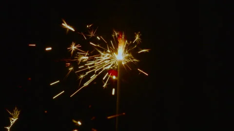 Slow Motion. Burning sparkler with bright golden sparks Vídeos de archivo 323709741