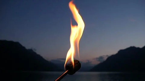 Slow motion of burning torchlight flame at romantic night sky background Stock Footage 64802286