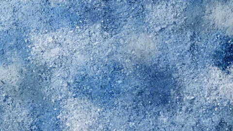 Slow-motion burst of blue powder smears Stock Footage 337125979