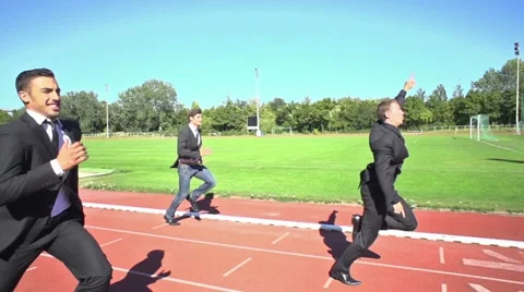 Slow motion business men finishing run Stock Footage