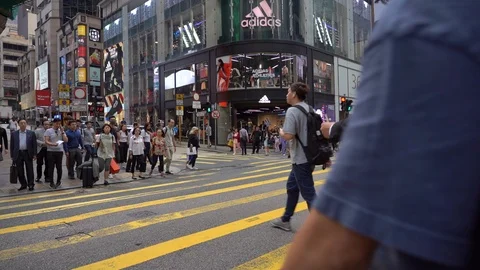 Slow Motion of Busy streets of Central District in Hong Kong and Pedestrians  Stock Footage 125649364