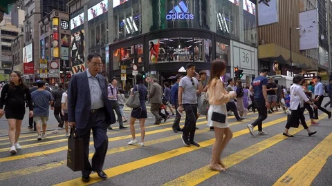 Slow Motion of Busy streets of Central District in Hong Kong and Pedestrians  Stock Footage 125649366
