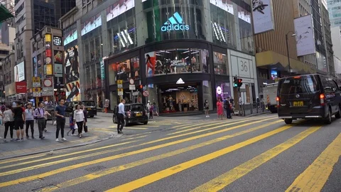 Slow Motion of Busy streets of Central District in Hong Kong and Pedestrians  Stock Footage 125649367