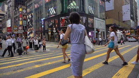 Slow Motion of Busy streets of Central District in Hong Kong and Pedestrians  Stock Footage 125649370