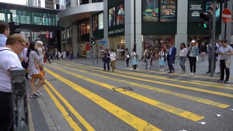 Slow Motion of Busy streets of Central District in Hong Kong and Pedestrians  Stock Footage 125649372