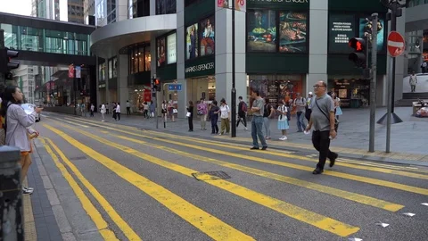 Slow Motion of Busy streets of Central District in Hong Kong and Pedestrians  Stock Footage 125649376