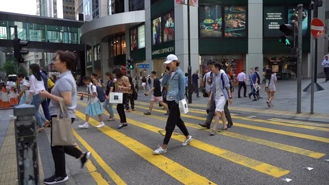 Slow Motion of Busy streets of Central District in Hong Kong and Pedestrians  Stock Footage 125649380