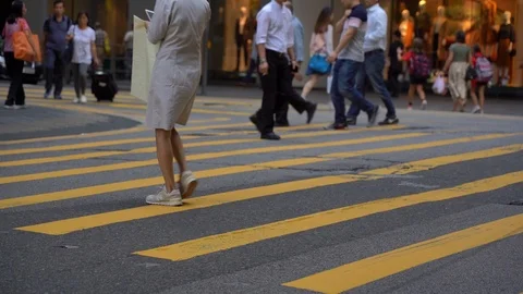 Slow Motion of Busy streets of Central District in Hong Kong and Pedestrians  Stock Footage 125649381