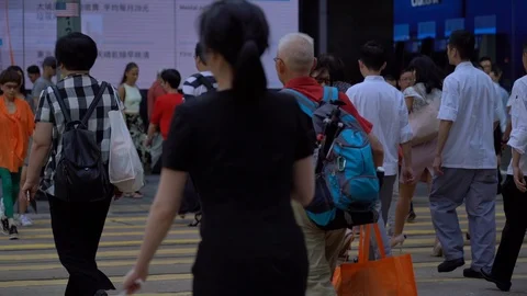 Slow Motion of Busy streets of Central District in Hong Kong and Pedestrians  Stock Footage 125649399
