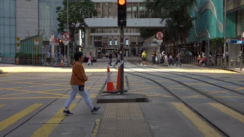 Slow Motion of Busy streets of Central District in Hong Kong and Pedestrians  Stock Footage 125649402