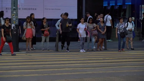 Slow Motion of Busy streets of Central District in Hong Kong and Pedestrians  Stock Footage 125649422