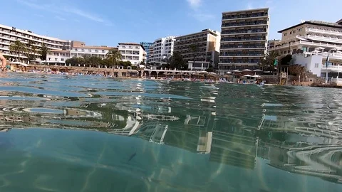 Slow motion of cala major beach in mallorca with waves entering the beach Stock Footage 122170499