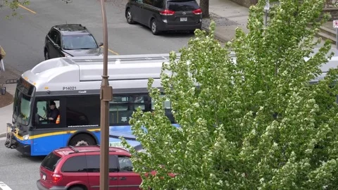 Slow motion of camera chasing bus on road in Coquitlam BC Canada. Stock Footage 75853615
