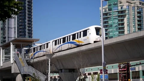 Slow motion of camera chasing skytrain left station in Coquitlam Evergreen line Video stock 76178988