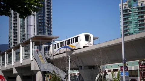 Slow motion of camera chasing skytrain left station in Coquitlam Evergreen line Stock Footage 76182868