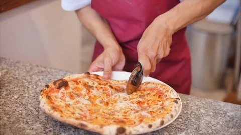Slow Motion Camera Freshly baked pepperoni pizza on a tree, sliced and served Stock Footage 127055532