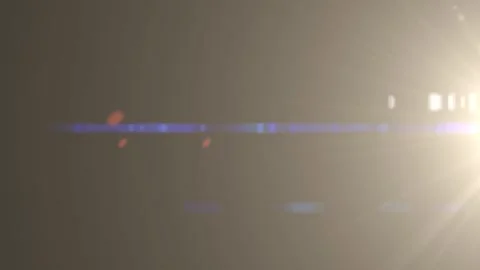 Slow motion camera lens flare moving effect on dark background overlay. 库存影片 344088075