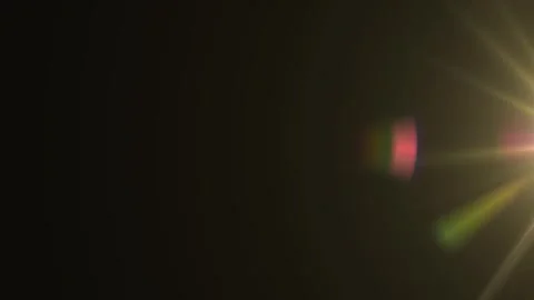 Slow motion camera lens flare moving effect on dark background overlay. 库存影片 344088088