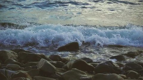 Slow motion camera movement up on the stony beach Stock Footage 81352661