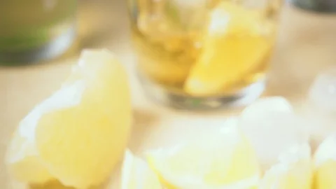 Slow motion camera moves and tea pours into glass Video stock 87756117
