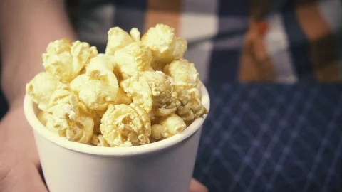 Slow motion the camera moves in a glass with popcorn and cola Video stock 87879993
