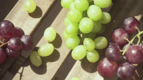 Slow motion the camera moves over the table with grapes and a drink Stock-Footage 89030834